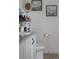 Stylish bathroom featuring a granite vanity, updated toilet, and decorative mirror at 5897 Soter Ln, Windermere, FL 34786