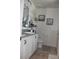 Bathroom featuring double sinks, a granite countertop, and plenty of storage space for toiletries at 5897 Soter Ln, Windermere, FL 34786