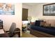 Well-organized bedroom with desk, chair, and daybed with elegant decor and artwork at 5897 Soter Ln, Windermere, FL 34786