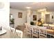 Open-concept dining area with stylish table and chairs, adjacent to the kitchen and staircase at 5897 Soter Ln, Windermere, FL 34786