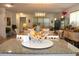 Open-concept dining area showcases modern lighting, a large dining table, and view into the great room at 5897 Soter Ln, Windermere, FL 34786