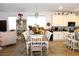 Dining room with a wooden table, seating for ten, and a china cabinet at 5897 Soter Ln, Windermere, FL 34786