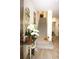 Warm entryway with stylish mirror, decorative accents, and staircase, creating an inviting first impression at 5897 Soter Ln, Windermere, FL 34786