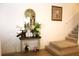 Inviting entryway area decorated with a mirror, flowers, and decorative ornaments at 5897 Soter Ln, Windermere, FL 34786
