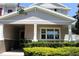 Charming home exterior with manicured landscaping, inviting entrance, and neutral-colored facade at 5897 Soter Ln, Windermere, FL 34786