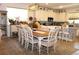 The kitchen and dining areas are connected and feature a large island, granite counters, and natural light at 5897 Soter Ln, Windermere, FL 34786