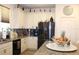 Bright kitchen features granite countertops, tiled backsplash, stainless steel appliances, and white cabinets at 5897 Soter Ln, Windermere, FL 34786