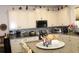 Spacious kitchen featuring white cabinets, granite counters, and stainless steel appliances, with barstool seating at 5897 Soter Ln, Windermere, FL 34786