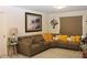 Comfortable living room with a sectional sofa, bright decor, and large windows for natural light at 5897 Soter Ln, Windermere, FL 34786