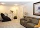 Relaxing living room with massage chair, comfortable seating, and neutral decor at 5897 Soter Ln, Windermere, FL 34786