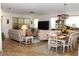 Bright living space featuring a comfortable sofa, dining table, and modern decor at 5897 Soter Ln, Windermere, FL 34786