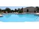Beautiful community pool area with clean, inviting water and ample lounge space at 5897 Soter Ln, Windermere, FL 34786