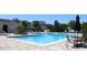 Large community pool with plenty of seating for residents and guests and neighborhood view at 5897 Soter Ln, Windermere, FL 34786
