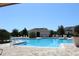 Beautiful community pool and lounge area with well-maintained brick pavers and bright blue water at 5897 Soter Ln, Windermere, FL 34786
