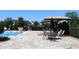 Community pool featuring lounge chairs and a gazebo at 5897 Soter Ln, Windermere, FL 34786