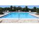 Beautiful community pool with brick pavers and a seating area providing a relaxing resort-like atmosphere at 5897 Soter Ln, Windermere, FL 34786