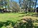 Lush green space with mature trees, creating a serene backyard setting for the community at 650 Woodridge Drive, Fern Park, FL 32730