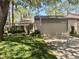 Charming home features a two-car garage and lush landscaping in a well-maintained community at 650 Woodridge Drive, Fern Park, FL 32730