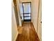 Inviting foyer with wood-look floors and convenient coat closet at 650 Woodridge Drive, Fern Park, FL 32730
