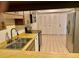 Kitchen with dual sink, updated appliances and pass through to dining or living area at 650 Woodridge Drive, Fern Park, FL 32730