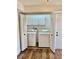 Convenient laundry area with washer, dryer, and built-in storage at 650 Woodridge Drive, Fern Park, FL 32730