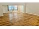 Open living room with hardwood floors, large windows, and lots of natural light at 650 Woodridge Drive, Fern Park, FL 32730