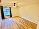 Bedroom features wood floors, natural light, and a ceiling fan at 650 Woodridge Drive, Fern Park, FL 32730