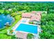 Community with pool, lounge chairs, clubhouse, and tennis courts at 650 Woodridge Drive, Fern Park, FL 32730