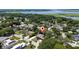 Aerial view of the property within a lakeside neighborhood at 7 Westchester Dr, Kissimmee, FL 34744