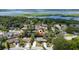 Scenic aerial view of a residential area with lush greenery and a lake in the background at 7 Westchester Dr, Kissimmee, FL 34744