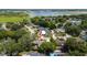 Aerial view of property in lush neighborhood near a lake, marked with a house icon at 7 Westchester Dr, Kissimmee, FL 34744