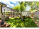 Inviting backyard oasis with screened-in porch, firepit lounge, and garden shed at 7 Westchester Dr, Kissimmee, FL 34744