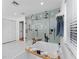 Bathroom with a freestanding tub, and a large glass-enclosed shower with black fixtures at 7 Westchester Dr, Kissimmee, FL 34744