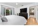 Bright bedroom with hardwood floors and french doors to outdoor living space at 7 Westchester Dr, Kissimmee, FL 34744