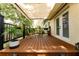 Charming deck with awning, perfect for outdoor dining and relaxing with potted plants at 7 Westchester Dr, Kissimmee, FL 34744