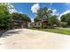 Screened in patio area connected to single story home with beautiful exterior details at 7 Westchester Dr, Kissimmee, FL 34744