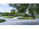 Charming home with a well-kept lawn, mature trees, and a long driveway at 7 Westchester Dr, Kissimmee, FL 34744