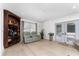 Cozy living area featuring a built-in bar, comfortable seating, and natural light at 7 Westchester Dr, Kissimmee, FL 34744