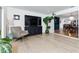 Modern living room with sleek hardwood floors, comfortable seating, and an open floor plan at 7 Westchester Dr, Kissimmee, FL 34744
