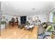 Open-concept living room with hardwood floors, comfortable seating, and stylish decor at 7 Westchester Dr, Kissimmee, FL 34744
