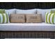Comfortable outdoor seating with decorative pillows, perfect for relaxation and unwinding in style at 7 Westchester Dr, Kissimmee, FL 34744