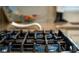 Close up of kitchen gas stovetop with sealed burners at 7 Westchester Dr, Kissimmee, FL 34744