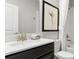 Bright bathroom featuring a vanity with modern fixtures, a mirror, and shower at 7876 Marlow Pl, Kissimmee, FL 34746