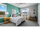 Cozy bedroom with bright wall, large windows, and comfortable furnishings at 7876 Marlow Pl, Kissimmee, FL 34746