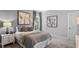 Comfortable bedroom with neutral tones, soft lighting, and stylish furnishings at 7876 Marlow Pl, Kissimmee, FL 34746