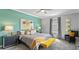 Stylish bedroom with colorful accents, soft bedding, and plenty of natural light at 7876 Marlow Pl, Kissimmee, FL 34746