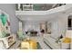 Inviting living room and dining area with stylish decor and a soaring two-story ceiling at 7876 Marlow Pl, Kissimmee, FL 34746