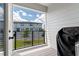 Balcony overlooking a well-maintained streetscape and neighboring townhomes at 8460 Sperry St, Orlando, FL 32827