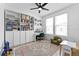 Bright home office with built-in shelving, a large desk, and comfortable seating, perfect for productivity at 8460 Sperry St, Orlando, FL 32827