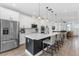 Bright kitchen boasts an island with bar seating, stainless appliances, and an open layout to the dining and living areas at 8460 Sperry St, Orlando, FL 32827
